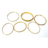 Five various 9ct gold bangles, approx 14.2g and a larger gold-plated example (6).
