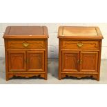 A pair of Oriental hardwood side cabinets, each with single drawer above twin door cupboard section,