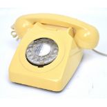 A vintage cream telephone.