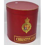 A Christys' London hat box in pillar box red.