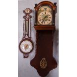 A reproduction walnut wall clock,