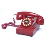 A vintage red telephone.