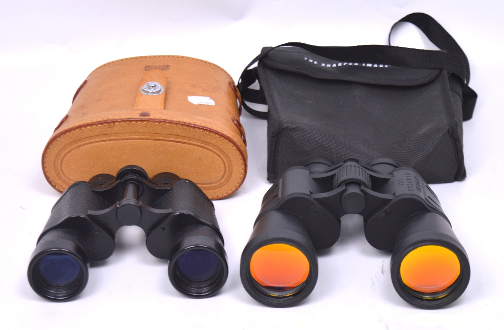A cased set of Bushnell Banner binoculars and a cased set of 'The Sharper Image' binoculars (2).