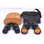 A cased set of Bushnell Banner binoculars and a cased set of 'The Sharper Image' binoculars (2).