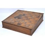 A vintage box with chessboard top containing two complete chess sets, one fruitwood and ebony,