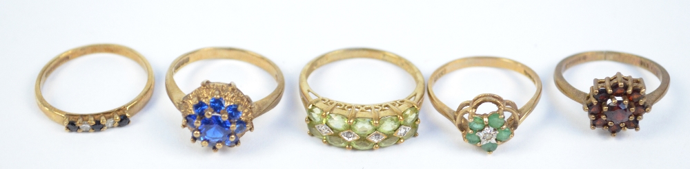 A group of five 9ct gold floral set dress rings.