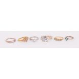 A small collection of dress rings including a 9ct yellow gold floral ring set with diamond chips,