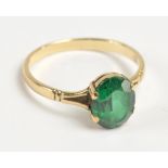 A yellow metal ring set with oval cut green spinel in claw setting, size T 1/2, 2.