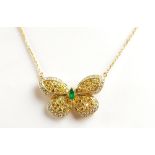 VAN CLEEF AND ARPELS; an 18ct gold emerald and diamond butterfly necklace,