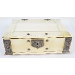 An unusual 19th century ivory and white metal mounted trinket box in the form of a book,