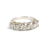 An 18ct white gold and diamond five stone ring, each round brilliant cut stone weighing approx 0.