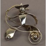 A Charles Horner hallmarked silver cowboy brooch with twisted wire lasso, stamped with register no.