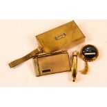 A vintage brass engine turned decorated lady's compact of rectangular form, a similar aide memoir,