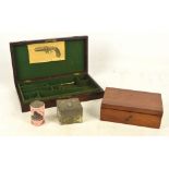 A mahogany pistol case with circular brass cartouche,