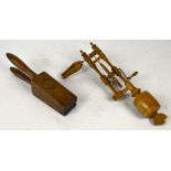 A late 19th/20th century treen lemon squeezer with turned handles and angled main body, length 28cm,