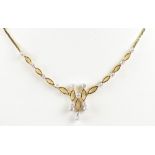 An 18ct yellow gold and diamond set necklace,