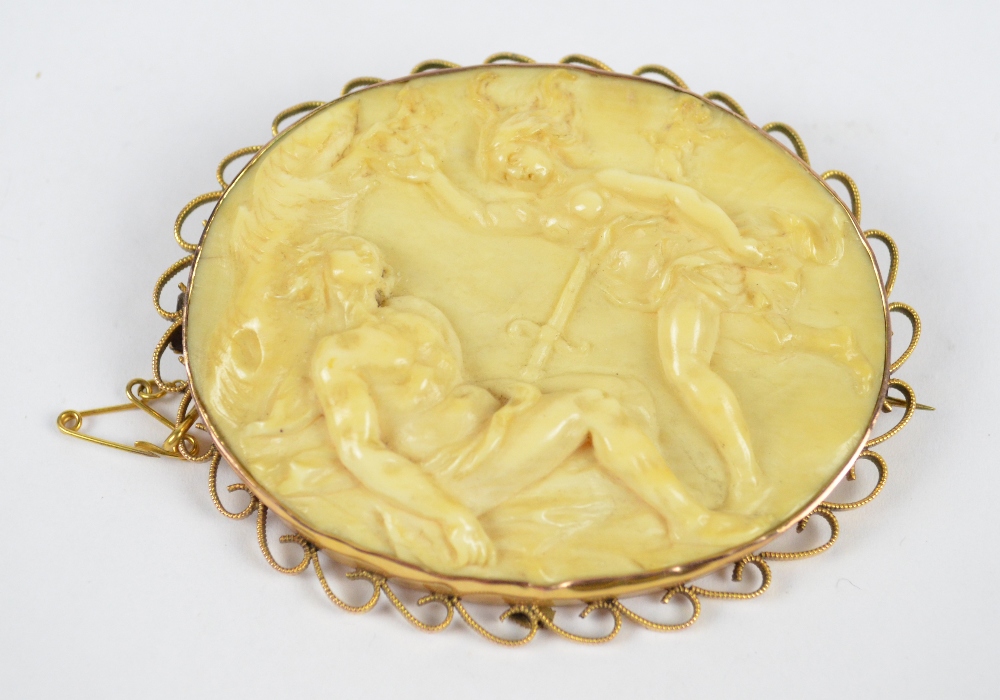 A 9ct yellow gold framed oval carved ivory brooch, c.