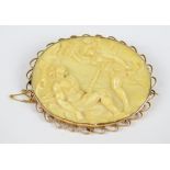 A 9ct yellow gold framed oval carved ivory brooch, c.