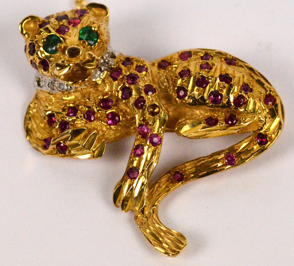A 9ct yellow gold ruby diamond and emerald set brooch modelled as a leopard, width 4cm, approx 12g. - Image 2 of 2