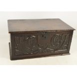 A late 17th century oak six plank box with hinged lid,