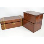 A late Victorian mahogany and brass bound campaign style writing slope with shaped escutcheon and