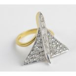 An 18ct yellow gold and white gold diamond set ring modelled as Concorde,