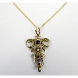 An Edwardian 9ct yellow gold Art Nouveau style open scroll pendant set with seed cultured pearls