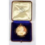 A 9ct yellow gold framed circular cameo brooch depicting the bust of a mythological goddess,