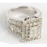 A 14ct white gold and diamond set ring,