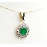 A 9ct yellow gold emerald and diamond floral set pendant suspended on a fine link chain,