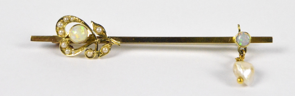 An Edwardian 9ct yellow gold opal and pearl bar brooch/tie pin with Art Nouveau stylised floral