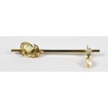 An Edwardian 9ct yellow gold opal and pearl bar brooch/tie pin with Art Nouveau stylised floral