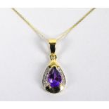 A 9ct yellow gold amethyst and diamond set pear shaped pendant on fine link chain,