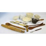 A collection of kitchenalia including ceramic jelly moulds, rolling pin, sieve, spoons, etc.