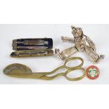 A mixed lot of collectors' items including an articulated clown and candle snuffers.