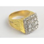 A gentleman's 18ct textured yellow gold platinum or white gold tipped diamond cluster ring,