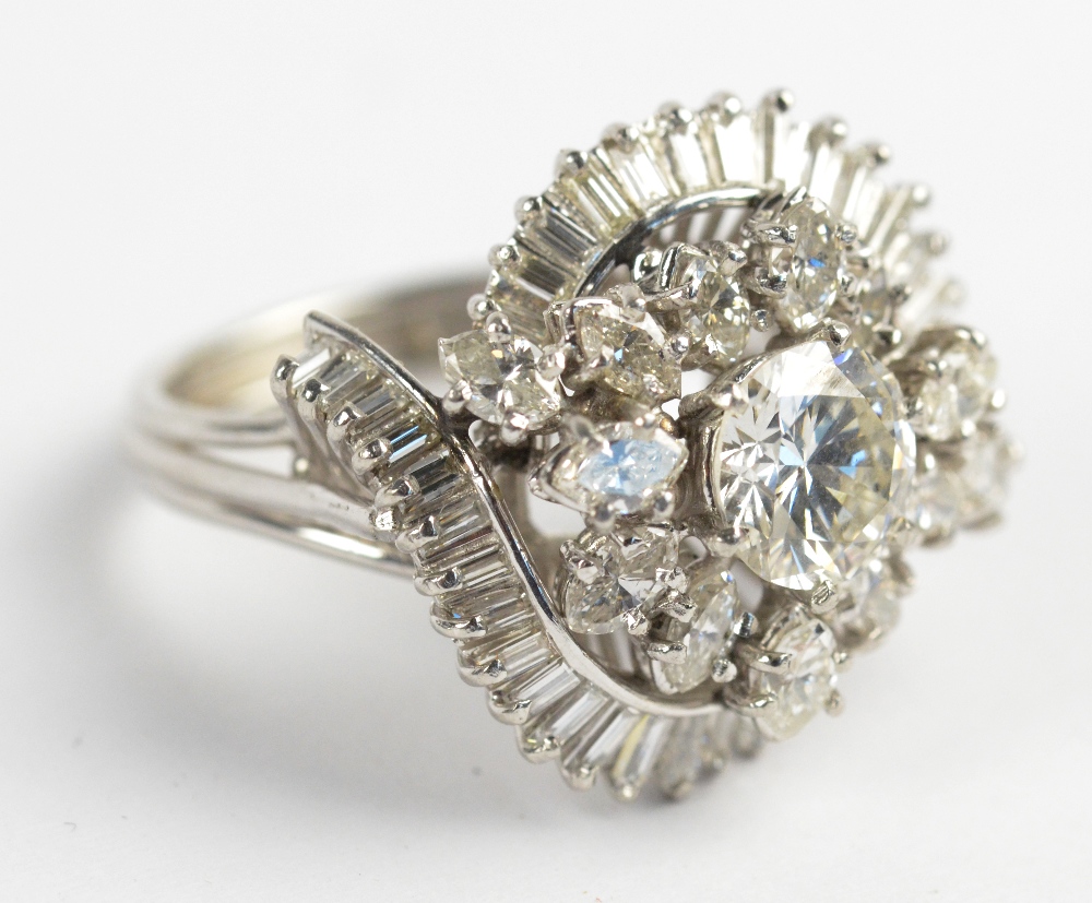 A white gold and diamond set ballerina/cluster ring,