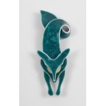 A Lea Stein brooch in the form of a dark turquoise fox with twisted end,