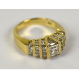 A 14ct yellow gold and diamond set stepped cluster ring,