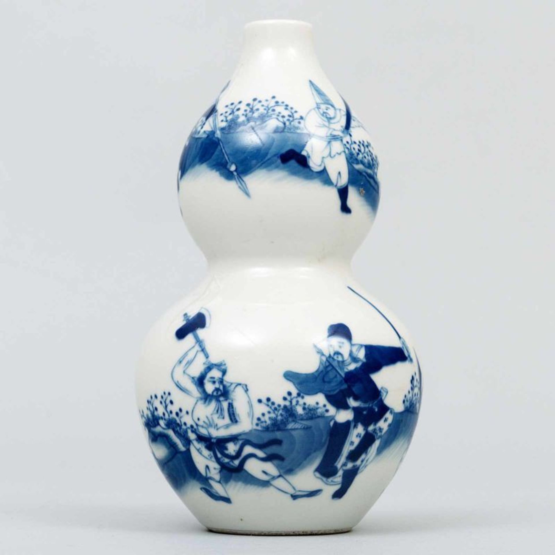 Jarrón Chino en forma de calabaza en porcelana azul y blanca. Trabajo Chino, Siglo XX. Presenta