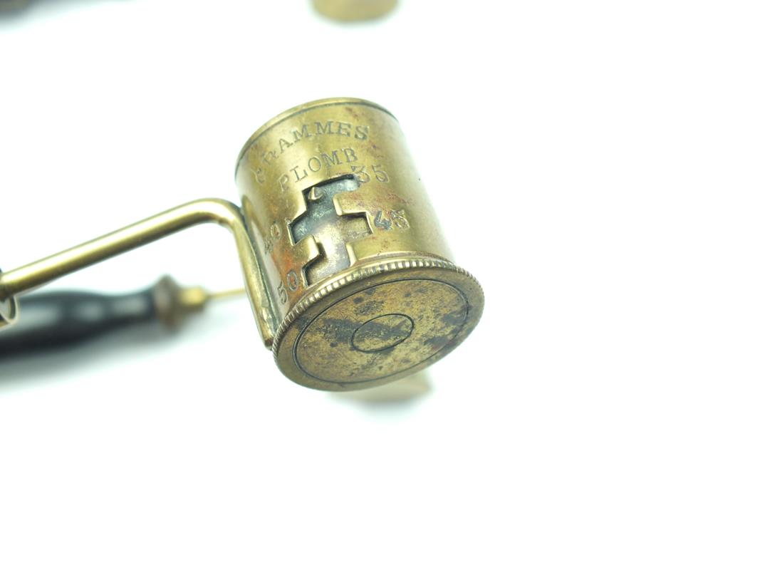 Five various shot and powder measures and dispensers, brass cups with turned wooden handles. (5) - Image 9 of 9