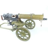 A deactivated Maxim Machine Gun and wheeled carriage, 72cm sighted barrel dated 1944 and stamped