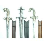 Three Indian Tulwar, the first with characteristic hilt with large disc pommel, the remainder with