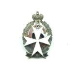 An Imperial Russian Irkutsk Infantry Regiment officer's badge, the white enamelled Maltese cross