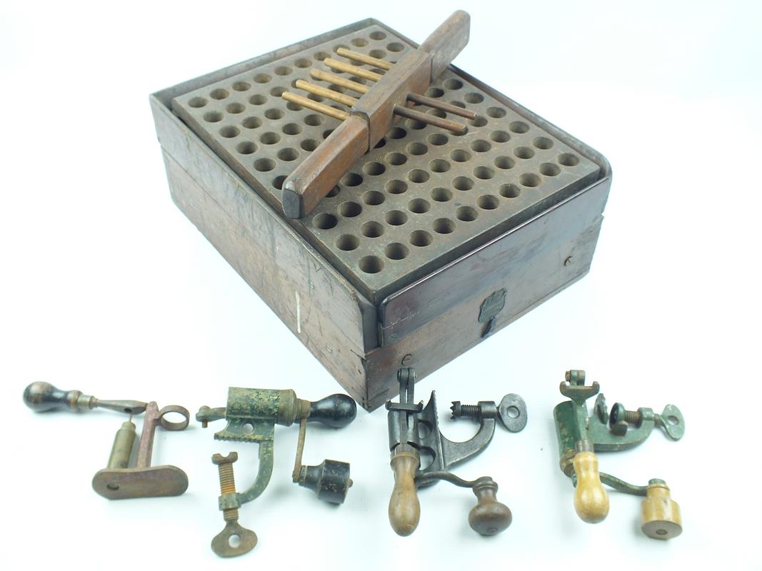 An Erskine patent reloading box, together with four various roll turnover tools. (5)