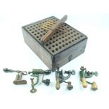 An Erskine patent reloading box, together with four various roll turnover tools. (5)