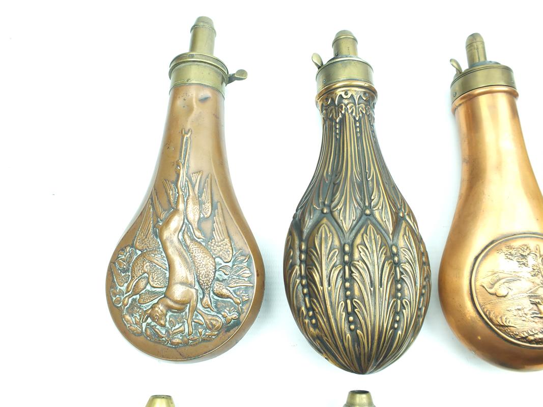 A Dixon & Sons embossed copper powder flask, decorated over all with Acanthus leaves, together - Image 2 of 9
