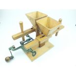 An unusual bench mounted wooden and iron shot dispenser reloading machine, the handmade box wood
