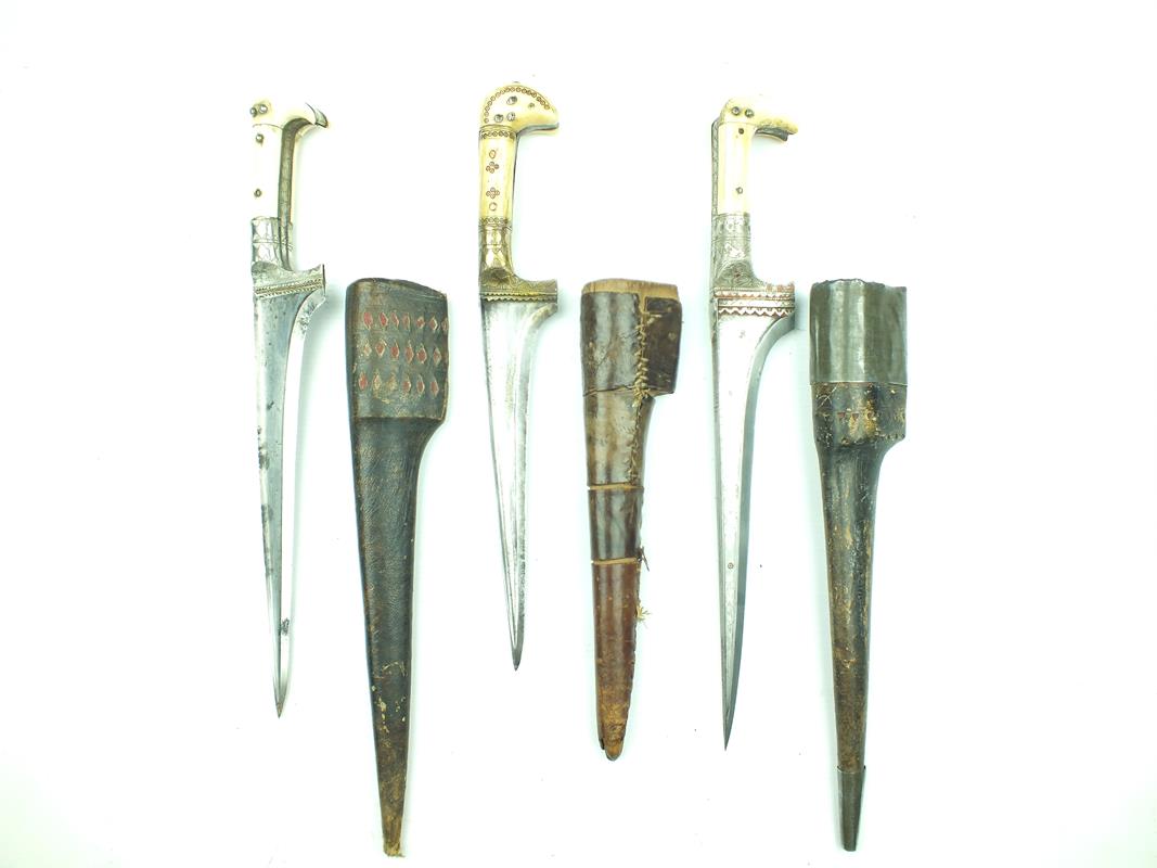 Three various Afghan Choora daggers, each with T-section blade, two with etched decoration,
