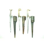 Three various Afghan Choora daggers, each with T-section blade, two with etched decoration,